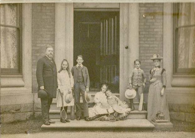 The Hart Family at Brooklands, Blackburn, c. 1890. Winnie is second from left standing next to her elder brother Edward. Alex Hart is the young boy on the steps held by his sister, Dora. 